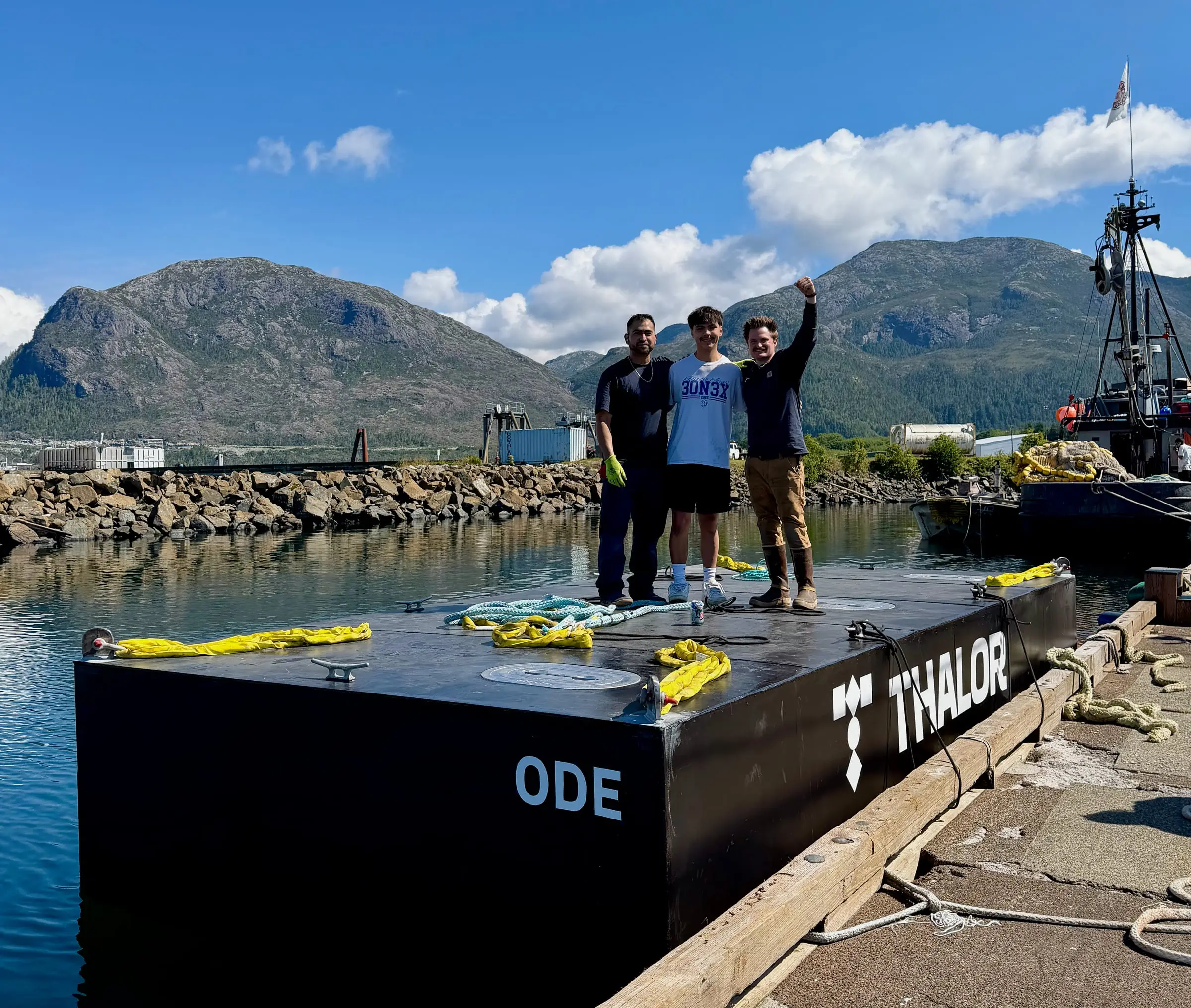 Adrian Garcia, Bryce Olin and Charlie Campbell standing on ODE-001 at the Metlakatla dock, just after launch